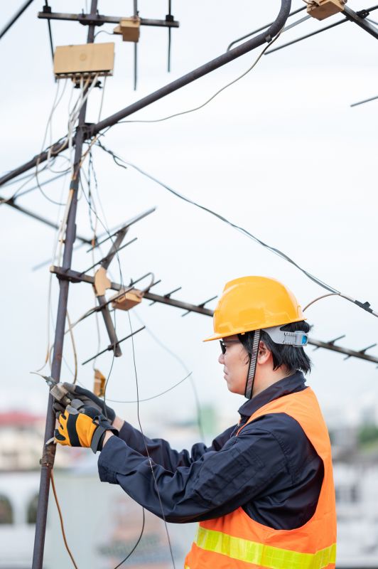 Technicians Repairing Antennas